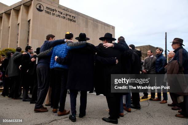 Members of the Jewish faith gather in front of the Tree of Life Synagogue for the Shabbat on Friday evening, November 2, 2018 in Pittsburgh's...