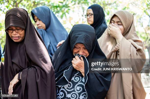 The aunt of rescue team member Syachrul Anto, who died during his efforts to search for the ill-fated Lion Air flight JT 610, and other family...