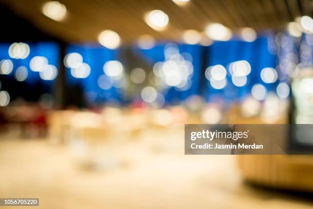 defocused public indoor place at night - blurred motion restaurant stock pictures, royalty-free photos & images