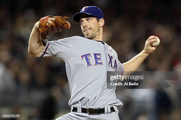 Cliff Lee of the Texas Rangers throws a pitch against the New York Yankees in Game Three of the ALCS during the 2010 MLB Playoffs at Yankee Stadium...