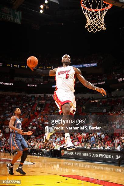LeBron James of the Miami Heat dunks against the Charlotte Bobcats during a game on October 18, 2010 at American Airlines Arena in Miami, Florida....