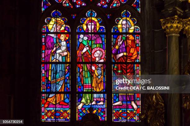 Virgin Mary and Child, St Anne with young Mary and St Joachim, stained-glass windows of Gothic cathedral of Saint John the Baptist, Wroclaw, Poland.