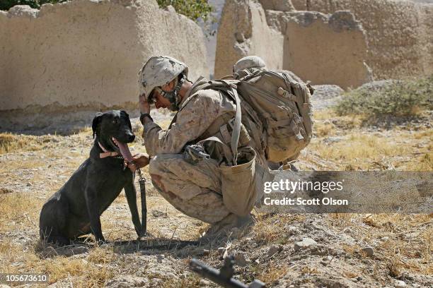 Marine Cpl. Jonathan Eckert of Oak Lawn, Illinois, attached to India Battery, 3rd Battalion, 12th Marine Regiment sits with his improvised explosive...