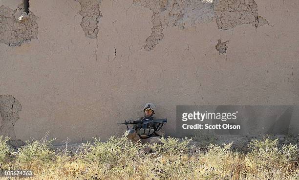 Marine Cpl. Jorge Villarreal of San Antonio, Texas with India Battery, 3rd Battalion, 12th Marine Regiment takes a break during a patrol near Forward...