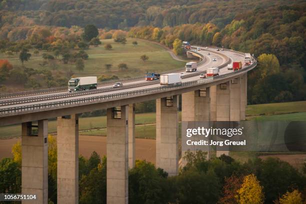 traffic on autobahn bridge (dawn) - autobahn foto e immagini stock