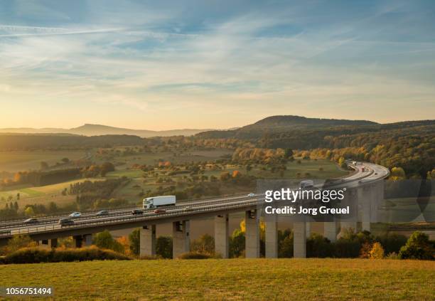 traffic on autobahn bridge (dawn) - north rhine westphalia fotografías e imágenes de stock