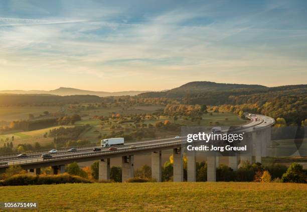 traffic on autobahn bridge (dawn) - north rhine westphalia photos et images de collection