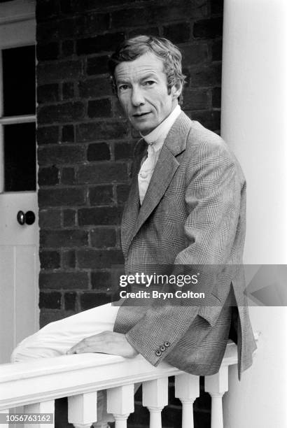 Jockey Lester Piggott, poses for a photograph in the winner's enclosure at Sandown Park racecourse before riding at the course in Esher, Surrey,...