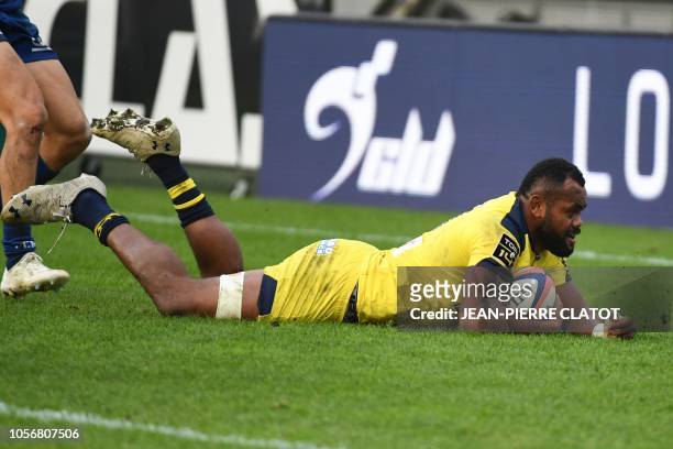 Clermont's Fijian winger Alivereti Raka scores a try during the French Top 14 rugby union match between Grenoble and Clermont on November 3, 2018 at...