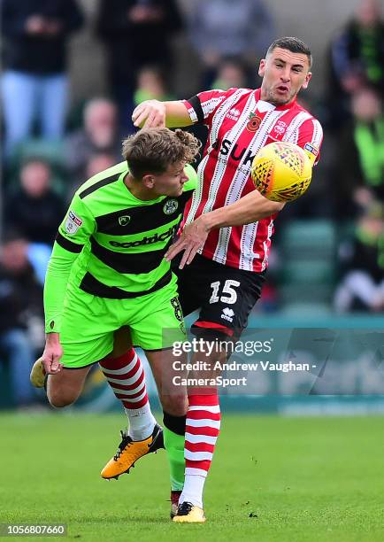 Lincoln City's James Wilson vies for possession with Forest Green Rovers' Dayle Grubb during the Sky Bet League Two match between Lincoln City and...