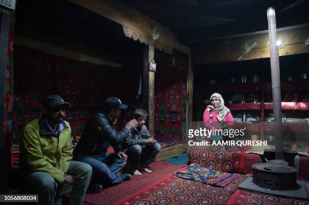 In this picture taken on May 5 Gul Dana , widow of Jahan Baig, a Pakistani mountaineer who died in the 2008 K-2 disaster, talks with relatives at her...