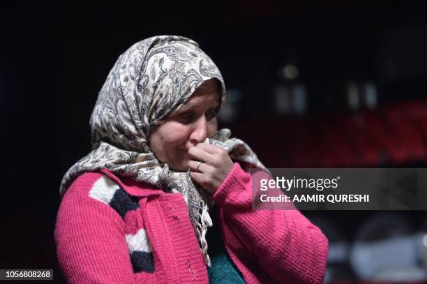 In this picture taken on May 5 Gul Dana, widow of Jahan Baig, a Pakistani mountaineer who died in the 2008 K-2 disaster, reacts during an interview...