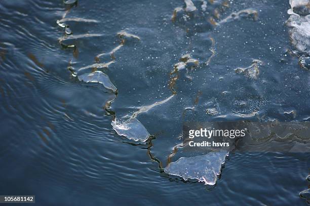 ice floe on a river - molten stock pictures, royalty-free photos & images