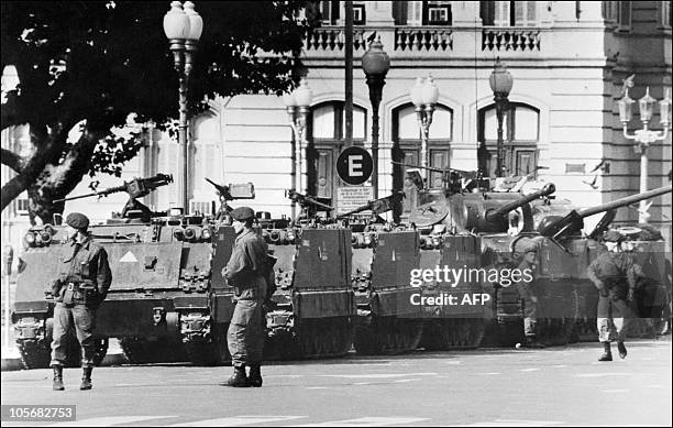 Tanks and soldiers stand in front of the Government Palace, the Casa Rosada, Buenos Aires, 24 March 1976. In the small hours of the morning,...