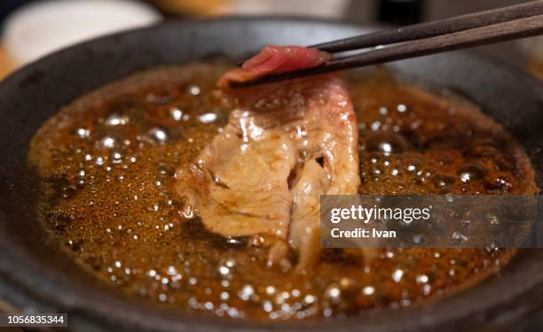 traditional japanese food, sukiyaki hot pot boiled, cooked beef, beef shabu shabu - sukiyaki stock-fotos und bilder