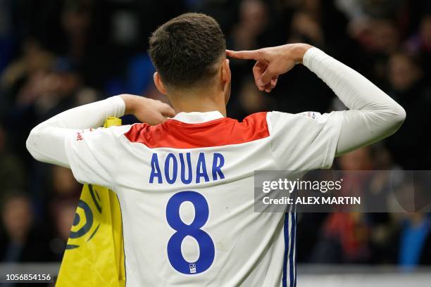 Lyon's French midfielder Houssem Aouar reacts after scoring a goal during the French L1 football match between Olympique Lyonnais and Girondins de...