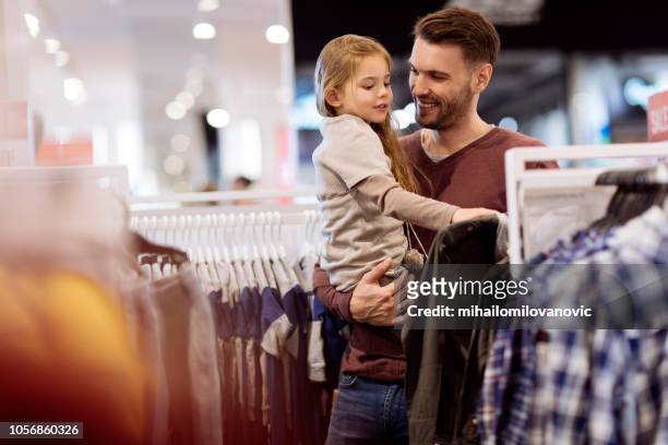 shirt shopping - family mall stock pictures, royalty-free photos & images