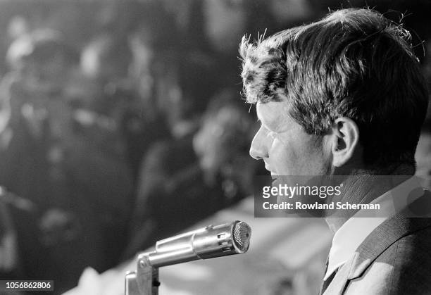 View of American senator Robert F Kennedy as he speaks into a microphone at an unspecifed rally during his campaign for the Democratic Party's...