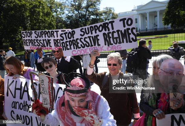 Protester dressed as Saudi Arabian crown prince Mohammad bin Salman, demonstrates with members of the group Code Pink outside the White House in the...