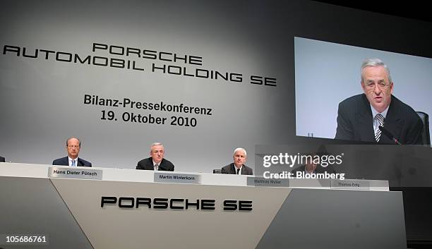 From left to right, Hans Dieter Poetsch, chief financial officer of Volkswagen AG, Martin Winterkorn, chief executive officer of Volkswagen AG,...