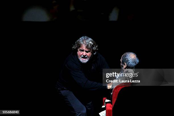 Italian comedian, blogger and political activist Beppe Grillo performs during one of his shows at the Teatro Goldoni on October 18, 2010 in Livorno,...