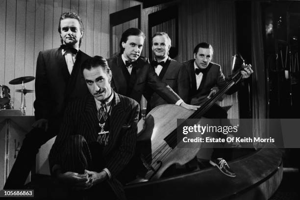 English pop group The Kinks during the video shoot for their single 'Come Dancing', 1982. Left to right: keyboard player Ian Gibbons , singer Ray...