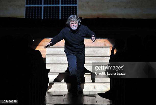 Italian comedian, blogger and political activist Beppe Grillo performs during one of his shows at the Teatro Goldoni on October 18, 2010 in Livorno,...