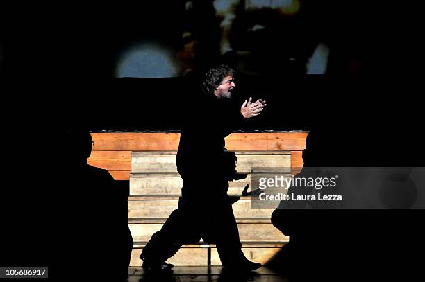 Italian comedian, blogger and political activist Beppe Grillo performs during one of his shows at the Teatro Goldoni on October 18, 2010 in Livorno,...