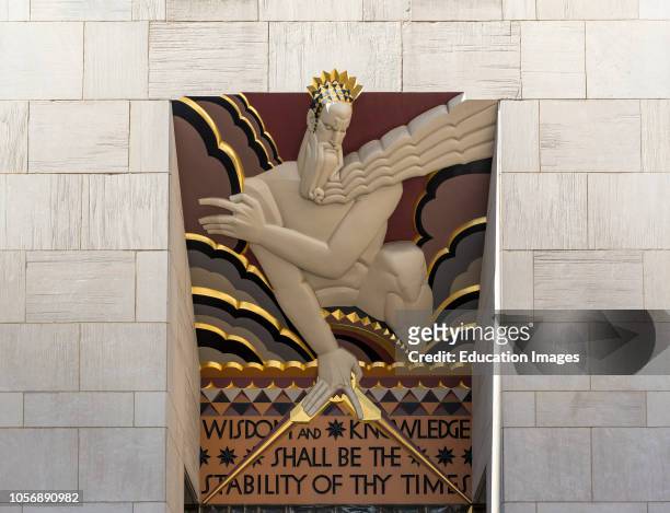 Art Deco sculpture Wisdom and Knowledge at entrance to 30 Rockefeller Plaza, Comcast Building, Rockefeller Center, New York, USA.