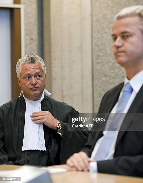 Dutch anti-Islam politician Geert Wilders waits for the start of his trial next to his lawyer Abraham Moszkowicz in the courtroom in Amsterdam,...