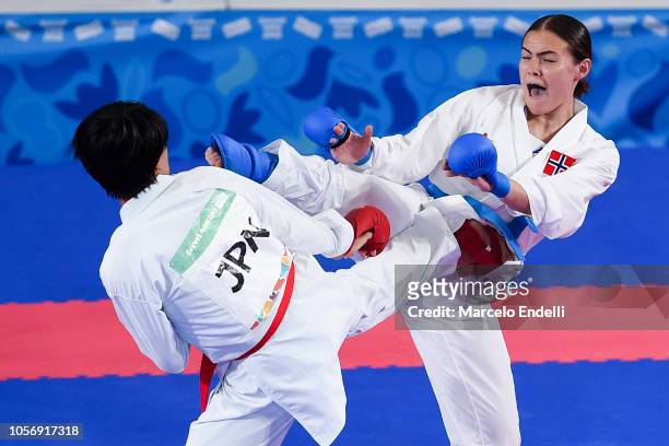 Sakura Sawashima of Japan and Annika Saelid of Norway compete in the Women's Kumite +59kg Final Bout during day 12 of the Buenos Aires Youth Olympic...