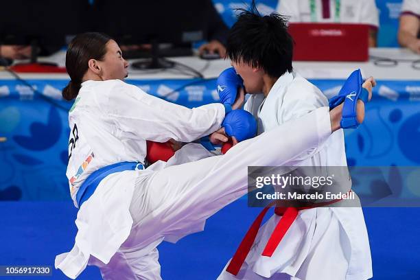 Sakura Sawashima of Japan and Annika Saelid of Norway compete in the Women's Kumite +59kg Final Bout during day 12 of the Buenos Aires Youth Olympic...