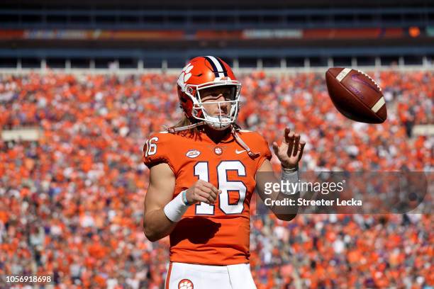 Trevor Lawrence of the Clemson Tigers warms up ahead of their game against the Louisville Cardinals at Clemson Memorial Stadium on November 3, 2018...