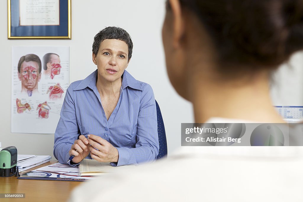 Doctor consulting with patient