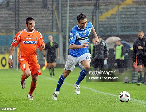 Andrea Caracciolo of Brescia competes with Mauricio Anibal Isla during the Serie A match between Brescia Calcio and Udinese Calcio at Mario Rigamonti...