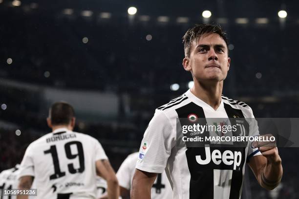 Juventus' Argentine forward Paulo Dybala celebrates after scoring during the Italian Serie A football match Juventus vs Cagliari at the Juventus...