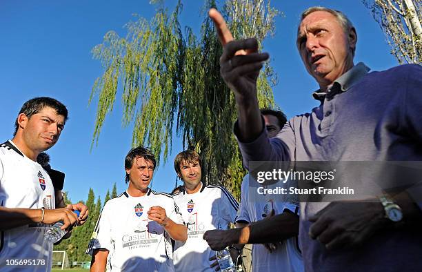 Dutch football legend Johan Cruyff gives instructions to his team during charity football match between players and caddies of the european tour and...