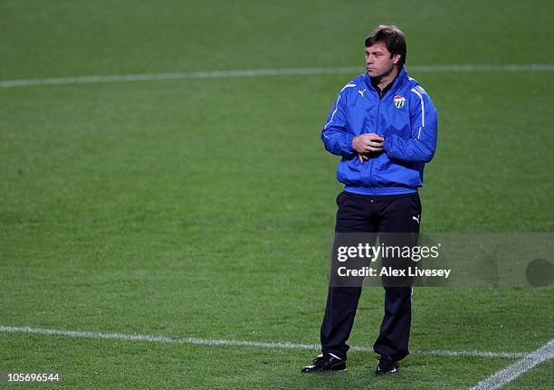 Ertugrul Saglam the coach of Buraspor looks on during a training session at Old Trafford on October 19, 2010 in Manchester, England.
