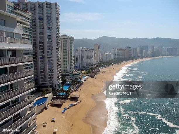 On a recent weekday, the main tourist beach of Acapulco was nearly empty. The resort has been wracked by drug-related violence.