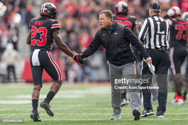 Ohio State Buckeyes defensive coordinator Greg Schiano celebrates with Ohio State Buckeyes safety Jahsen Wint after the Buckeye defense caused a...