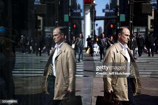 Man with a briefcase walks the streets of Midtown Manhattan, home to many of the world's banks on April 9, 2009 in New York City.