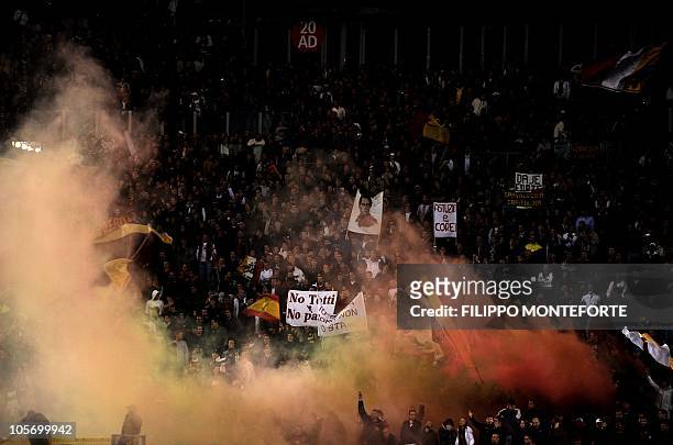 Roma's fans cheer their team against FC Basel during their champions league football match against AS Roma during their champions league football...