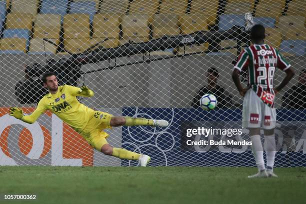 Goalkeeper Julio Cesar of Fluminense attempts to save the penalty kicks by Maxi Lopez of Vasco da Gama during a match between Fluminense and Vasco da...