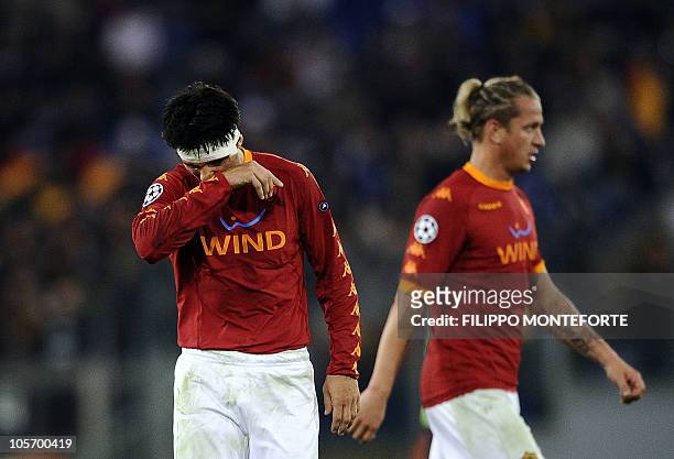 Roma's argentinia defender Nicolas Burdisso and French defender Philippe Mexes react during their group E Champion's League football match against FC...