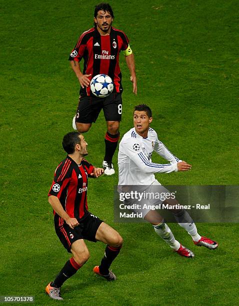 Cristiano Ronaldo of Real Madrid and Gianluca Zambrotta and Gennaro Gattuso of Milan during the UEFA Champions League group G match between Real...