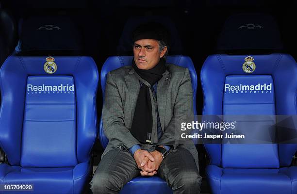 Head coach Jose Mourinho of Real Madrid looks on while seated on the bench prior to the start of the UEFA Champions League group G match between Real...