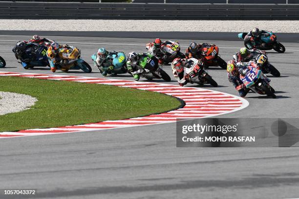 Riders take the start of the Moto3 race of the Malaysia MotoGP at the Sepang International Circuit in Sepang on November 4, 2018.