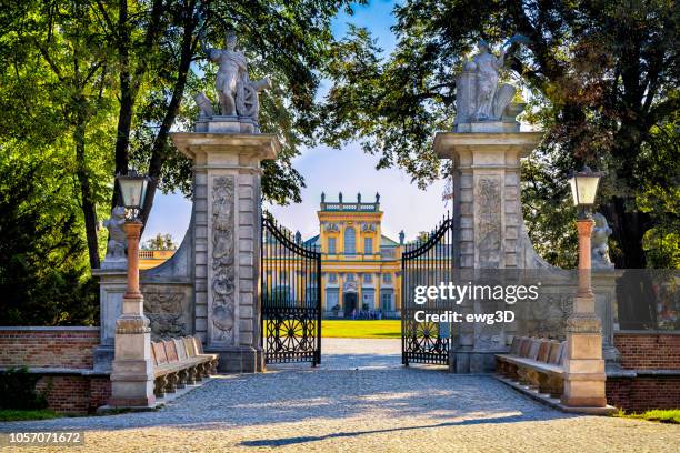 the entrance gate to the restored baroque wilanow royal palace, warsaw, poland - old castle entrance stock pictures, royalty-free photos & images