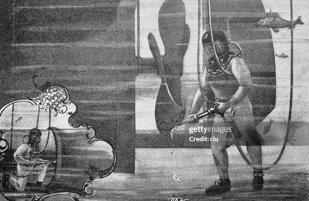 Homem usando a máquina de ar pressurizado debaixo d'água