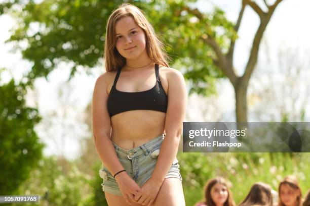 portrait of young woman - tween girl swimsuit stock-fotos und bilder